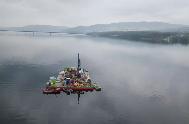 Beautiful shot of the barge with sonic drilling rig on the Mjøsa lake in Norway