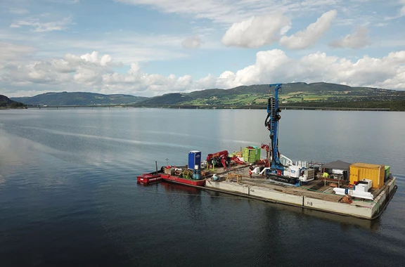 The complete sonic drilling and CPT testing set up on the barge